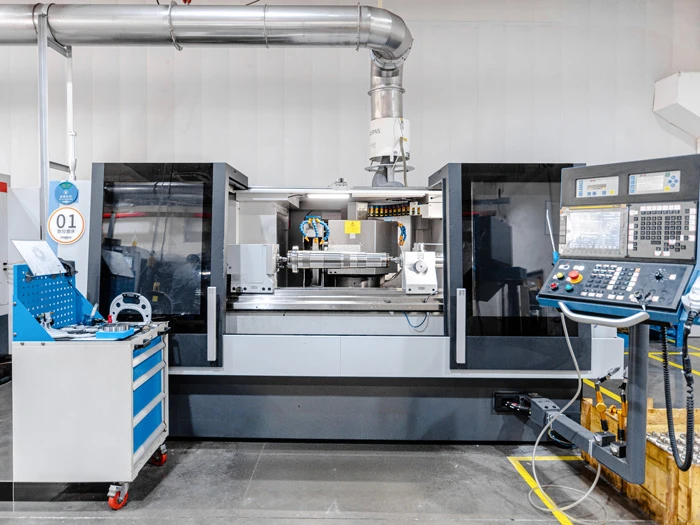 Large CNC machining center with operator panel and tool management system