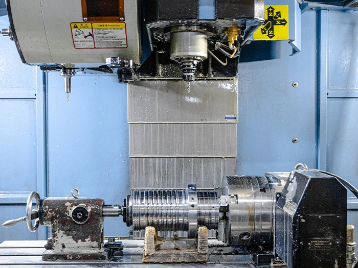 Skilled technicians operating precision grinding equipment
